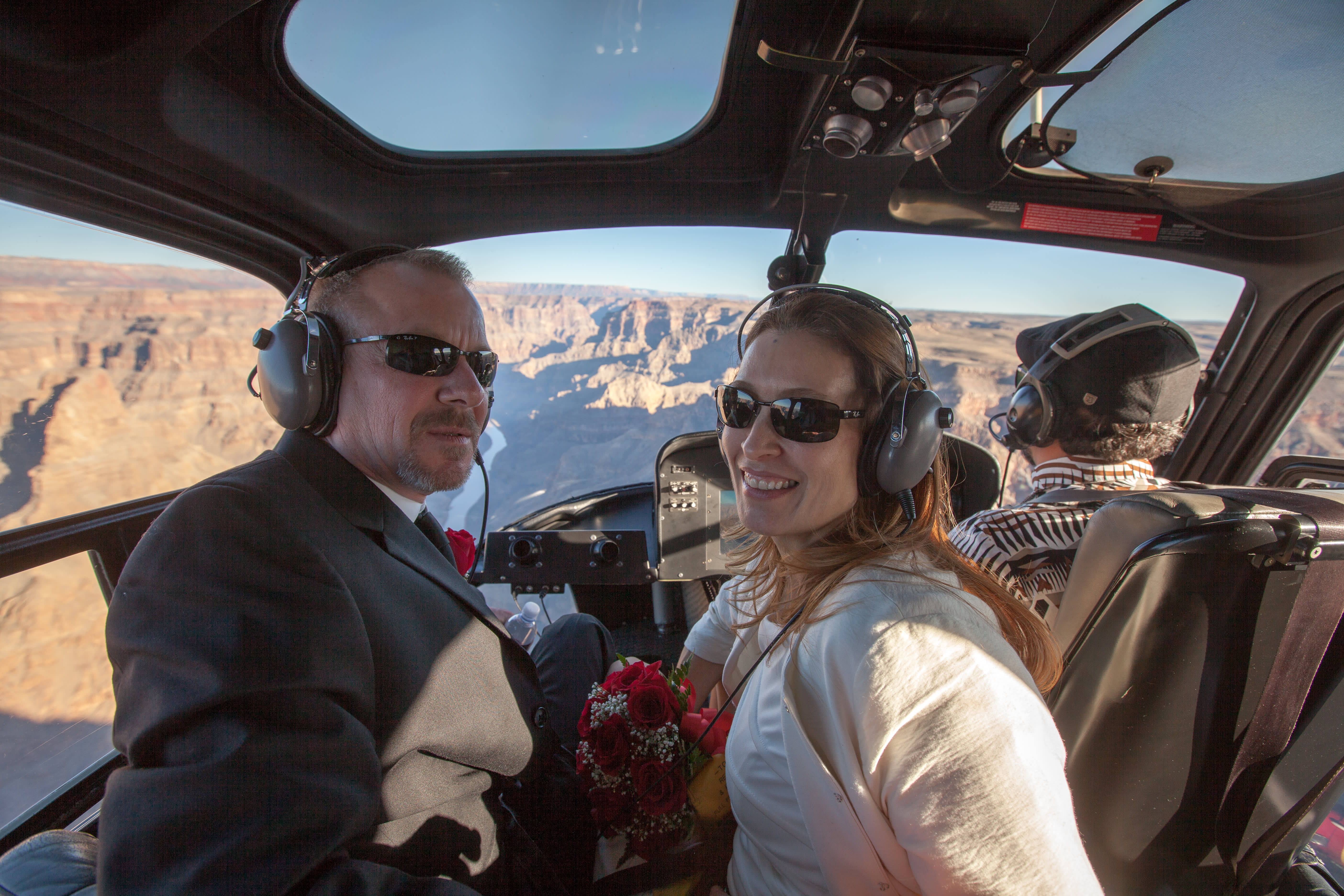 Grand Canyon helicopter wedding ceremony package including a Private Wedding Coordinator, luxury jet helicopter, private SUV and wedding cake